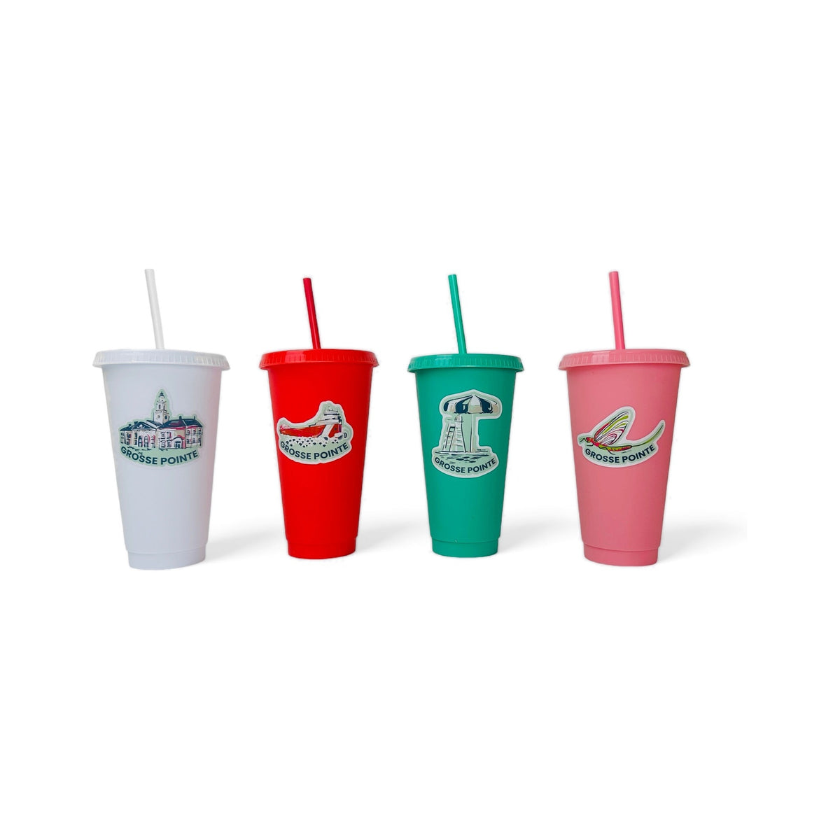 Four Grosse Pointe Pop Art stickers applied to white, red, green and pink tumblers: Grosse Pointe South, Freighter, Lifeguard Umbrella and Fish Fly