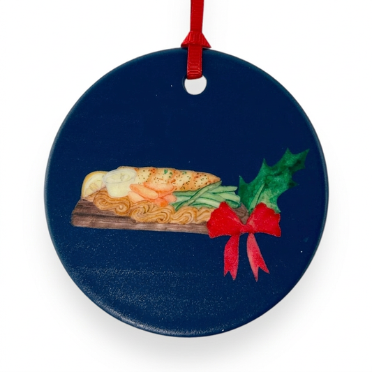 Planked Whitefish ceramic Christmas ornament close-up on white background