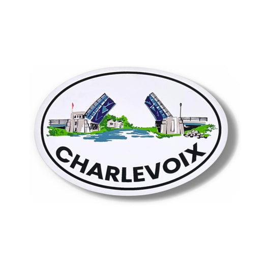 Drawbridge 5-inch oval vinyl sticker by TWAL: the Charlevoix drawbridge raised over blue water inside a navy oval, with CHARLEVOIX below, Charlevoix Pop Art Collection