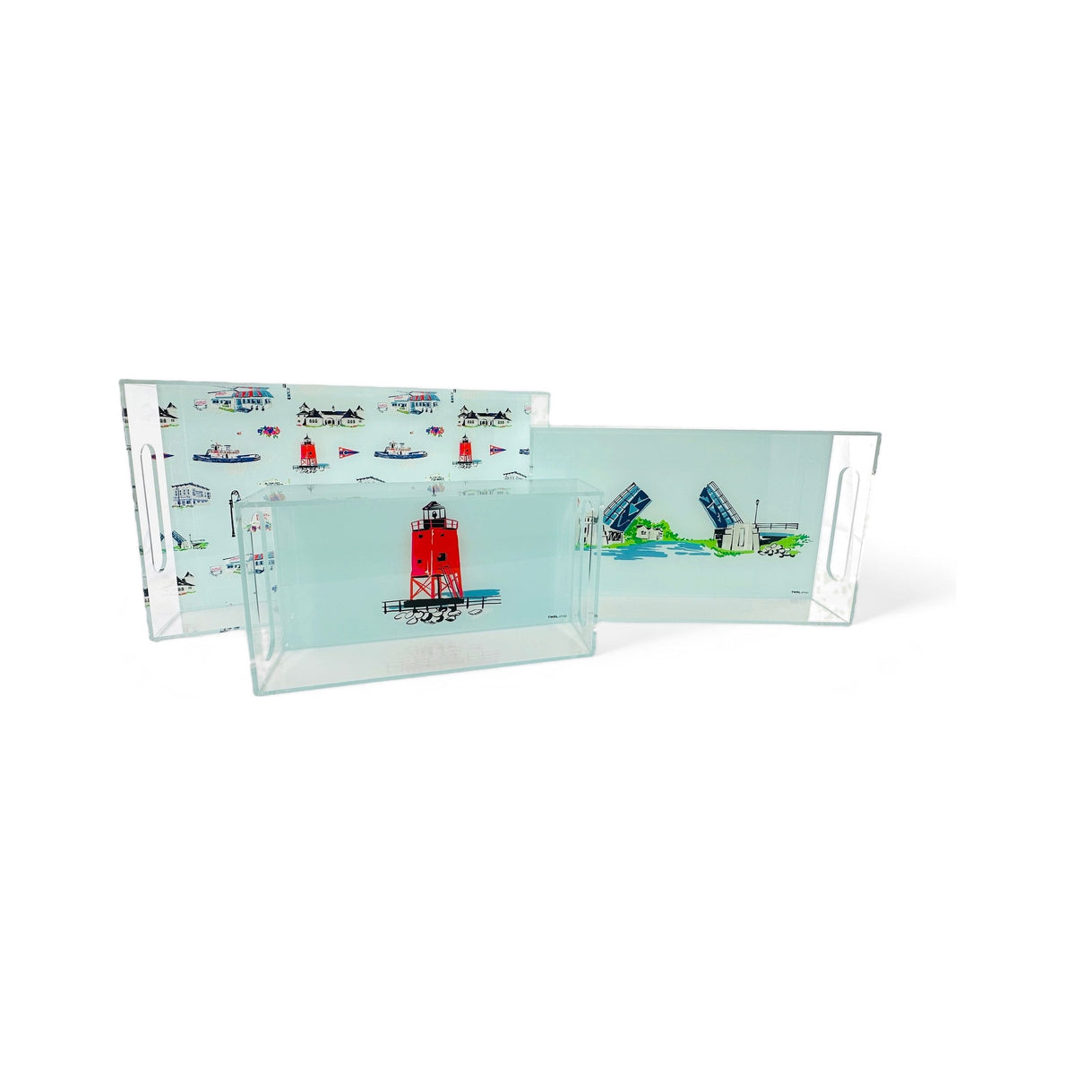 Three TWAL lucite trays: the Charlevoix toile large tray, the Drawbridge medium tray and the South Pier Lighthouse small tray