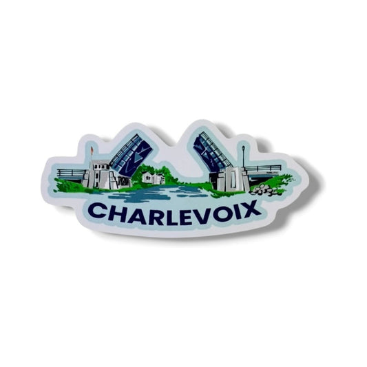 Drawbridge 3-inch vinyl sticker by TWAL: the Charlevoix drawbridge raised over blue water and green shoreline, with CHARLEVOIX below, Charlevoix Pop Art Collection