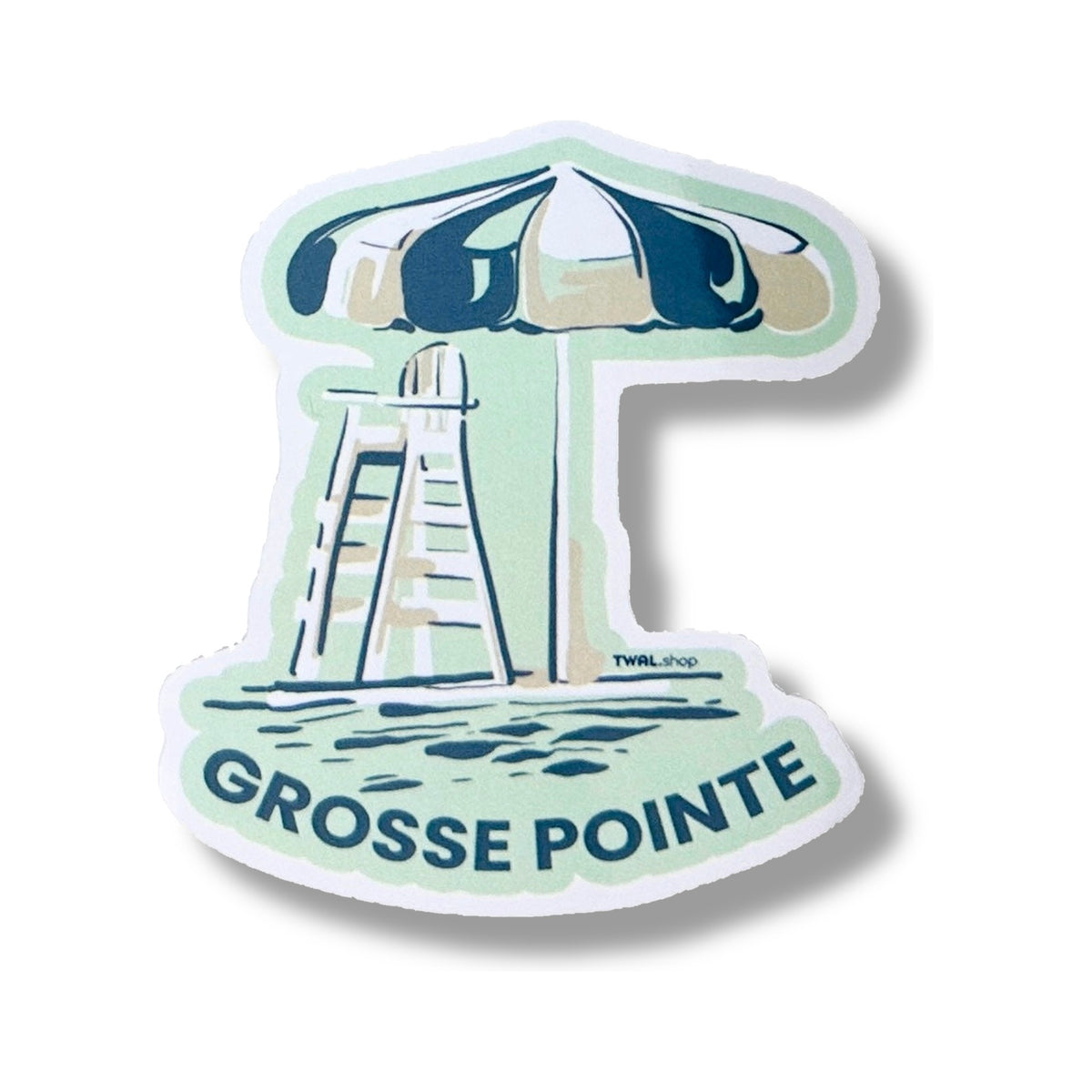 Lifeguard Umbrella 3-inch vinyl sticker from the Grosse Pointe Pop Art Collection: a navy and white striped umbrella over a lifeguard chair on a mint background, with GROSSE POINTE in navy below