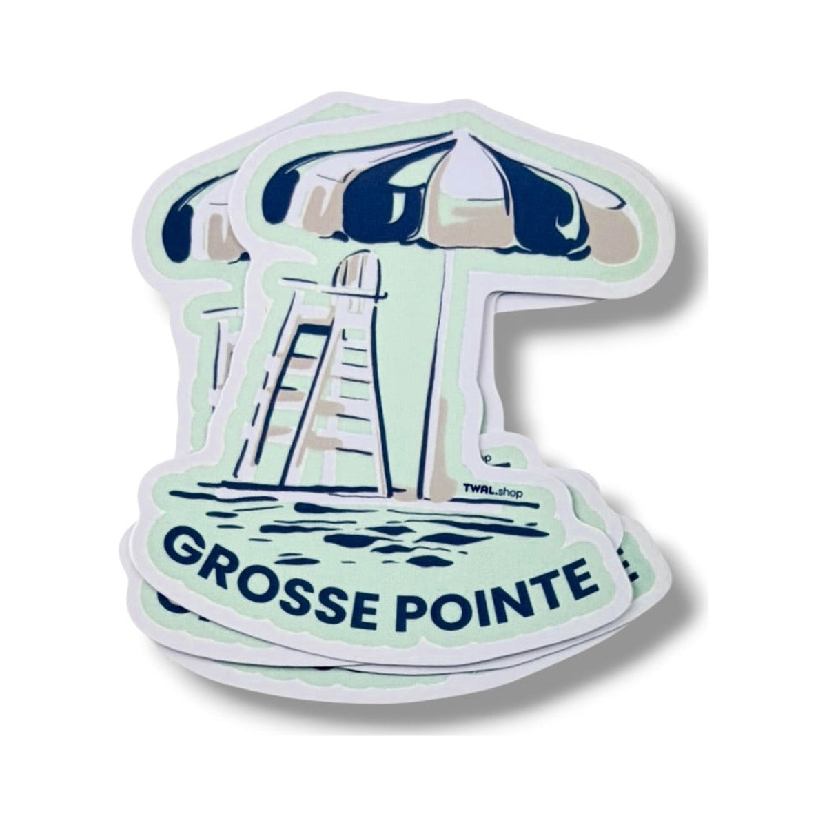 A stack of Lifeguard Umbrella 3-inch vinyl stickers from the Grosse Pointe Pop Art Collection, showing the layered die-cut edges