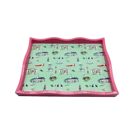 Large pink lacquer tray by TWAL with a scalloped edge and mint Grosse Pointe Pop Art toile showing local landmarks, umbrellas, wagons, fish flies and freighters