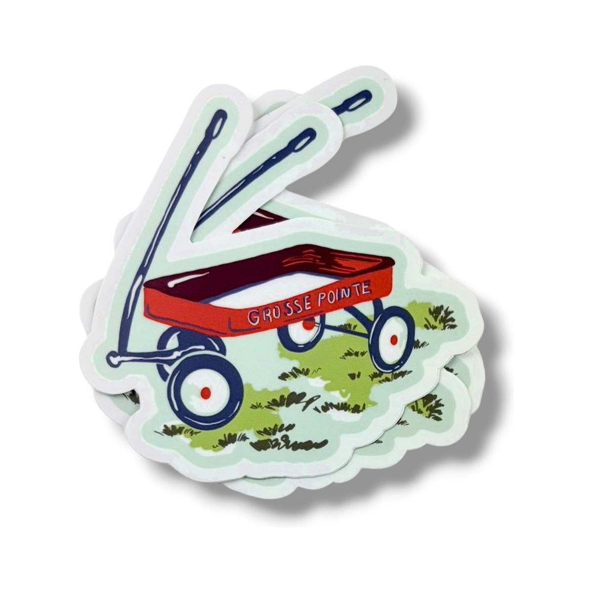 A stack of Wagon 3-inch vinyl stickers from the Grosse Pointe Pop Art Collection, showing the layered die-cut edges