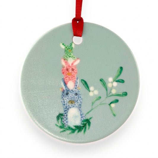 Herend Bunnies ceramic Christmas ornament close-up on white background, by TWAL