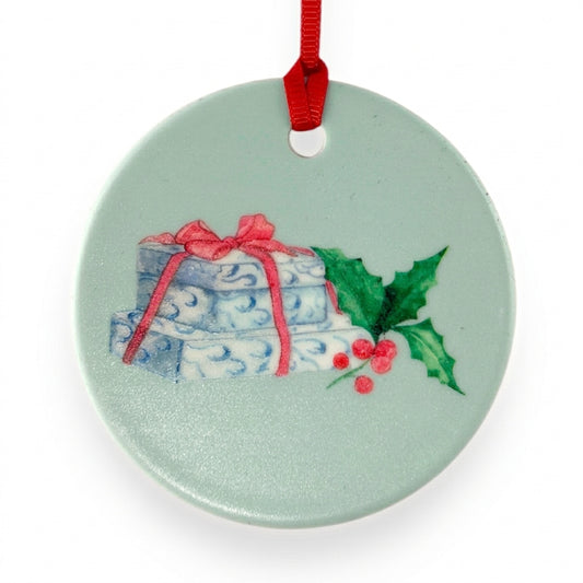 Jacobson's Gift Box ceramic Christmas ornament close-up on white background, by TWAL