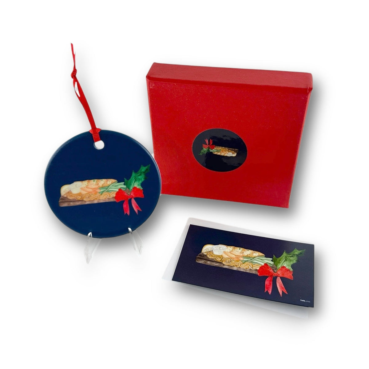Planked Whitefish ceramic Christmas ornament with red ribbon, Charlevoix, Michigan, by TWAL